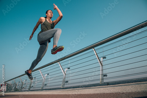 Marathon runner in motion outdoors stock photo