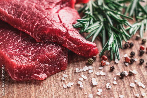 Fresh beef meat, raw beef steak with a sprig of rosemary. Healthy food