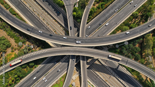 Bild auf Leinwand Aerial photo of multilevel junction highway overpass in urban area with beautifu