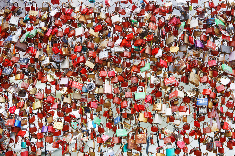 Closeup of love lockers at famous bridge Makartsteg in Salzburg, Austria. Padlocks of love on a bridge