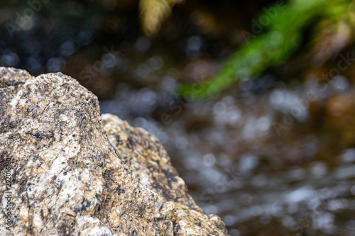 Rocks against a clear flowing stream