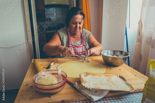 Slika na platnu italian woman make homemade pasta ravioli on wood board