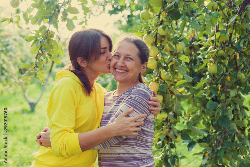 elderly woman with adult daughter elderly woman with adult daughter