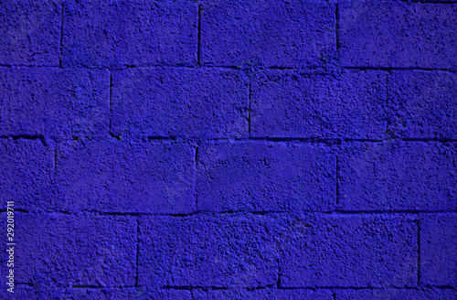 Deep purple paint on a block wall backdrop