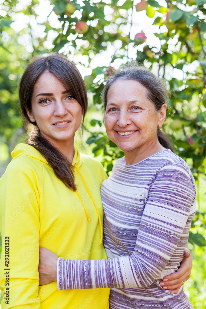 elderly woman with adult daughter elderly woman with adult daughter