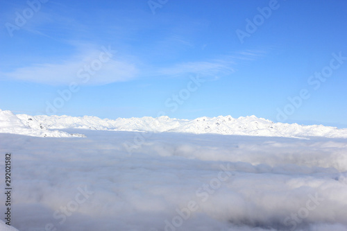 snow-covered mountains over the fog in british columbia
