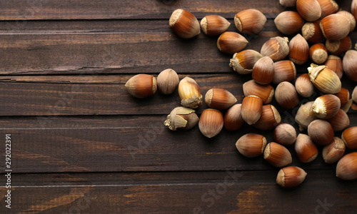 Ripe hazelnuts on wooden background
