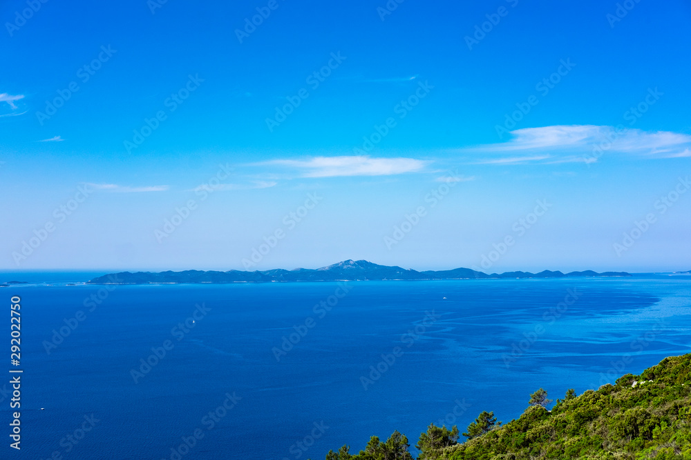 View on Lastovo Island, green nature, blue sky and clear Adriatic sea water, summer holidays, Dalmatia, Croatia
