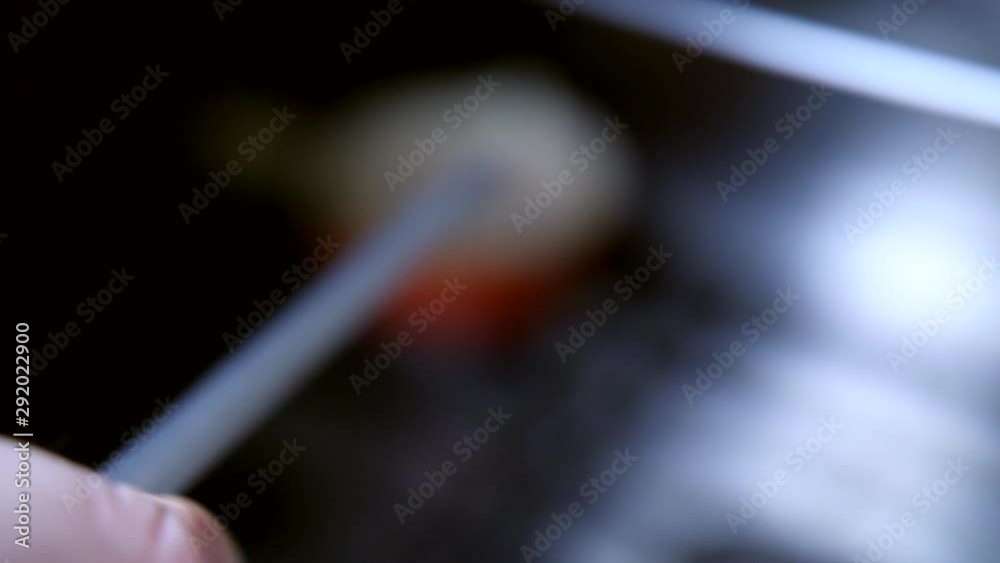 Slow motion - Chef sharpening dull knife with honing steel sharpener, in kitchen close up. Getting Ready To Make Food Slow motion - Chef sharpening dull knife with honing steel sharpener, in kitchen close up. Getting Ready To Make Food