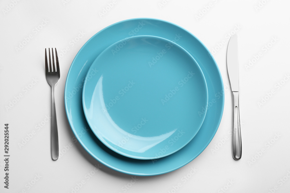 Elegant table setting on white background, top view Elegant table setting on white background, top view