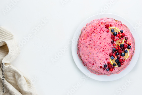 Homemade cranberry pie with lemon on a white table. Flat lay, horizontal orientation, copy space.