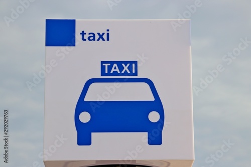 Sign in White and blue indicating the taxi stop at station Lansingerland Zoetermeer at the railway station Lansingerland Zoetermeer in the Netherlands photo