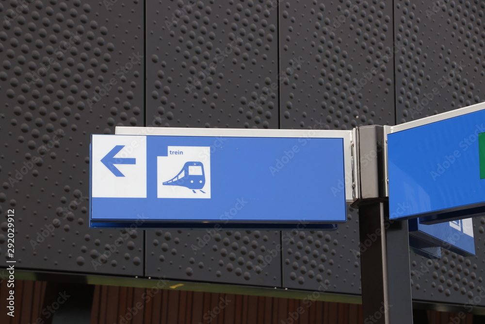 Direction signs at station platform at the railway station Lansingerland Zoetermeer in the Netherlands Direction signs at station platform at the railway station Lansingerland Zoetermeer in the Netherlands