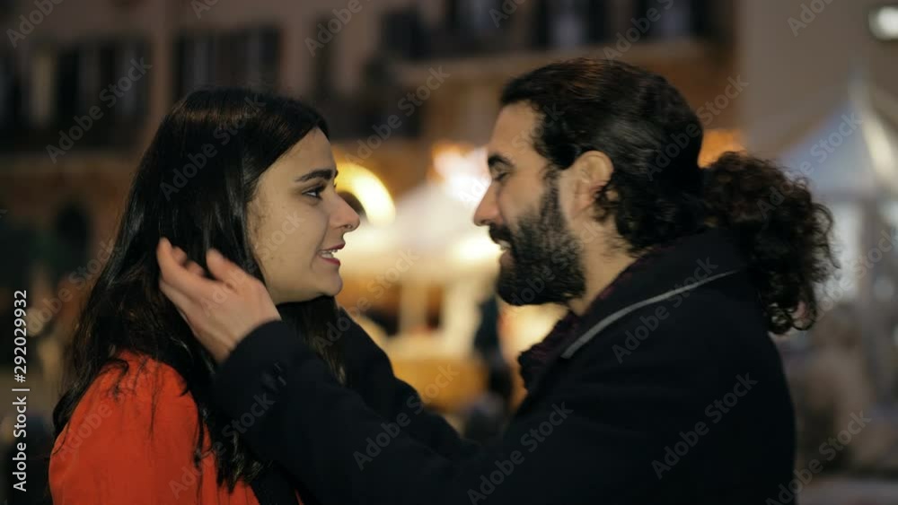 young woman refusing man's kiss in the city night.unrequited love,friend zone young woman refusing man's kiss in the city night.unrequited love,friend zone