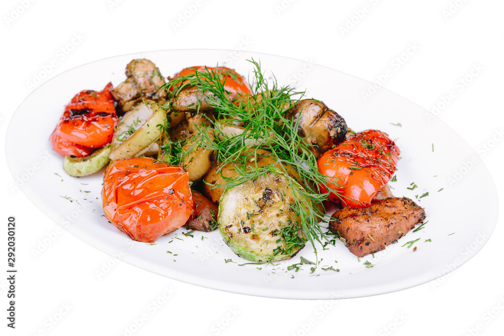 Grilled vegetables with mushrooms isolated on a white background Grilled vegetables with mushrooms isolated on a white background
