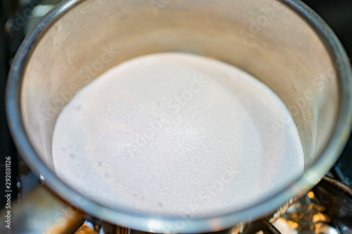 Close up shot of heating the sugar in a pan to make caramel