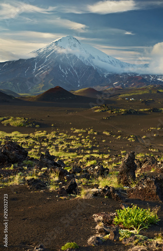 Foot of the extinct Tolbachinsky volcano in Kamchatka. Warm evening lighting and textured sky.