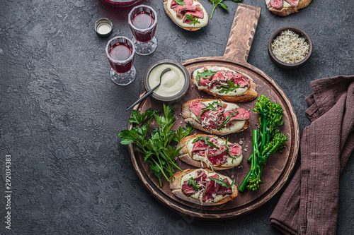 Tableau sur toile Tapas, pinxtos, party finger food with roast beef, copy space
