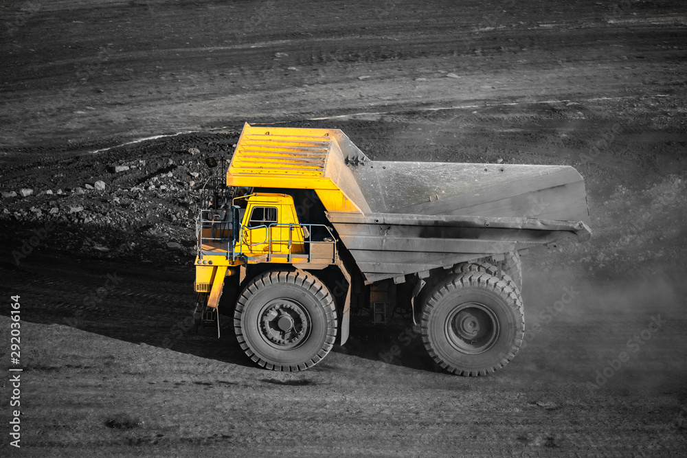 Big yellow mining truck empty body for anthracite. Open pit mine, extractive industry for coal Big yellow mining truck empty body for anthracite. Open pit mine, extractive industry for coal