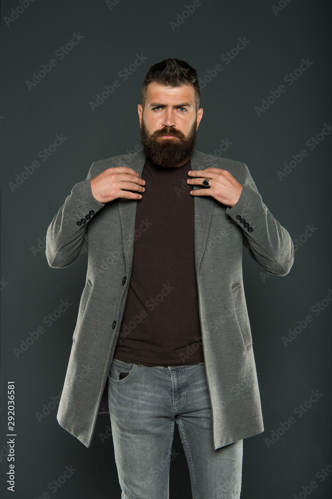 Masculine look. Brutal hipster man. Hipster wearing casual clothes. Hipster  beard and stylish haircut. Bearded man trendy hipster style. Monochrome  style outfit. Classy but modern. Fashion outfit Stock Photo