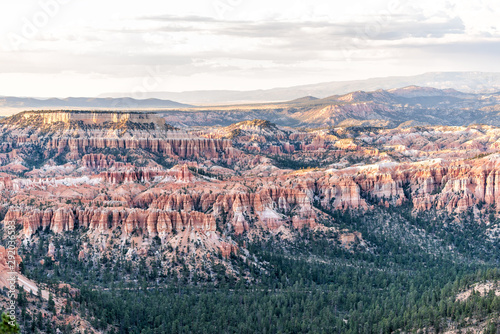 High angle view from overlook at Bryce point of hoodoos rock formations in Bryce Canyon National Park at sunset with sunlight