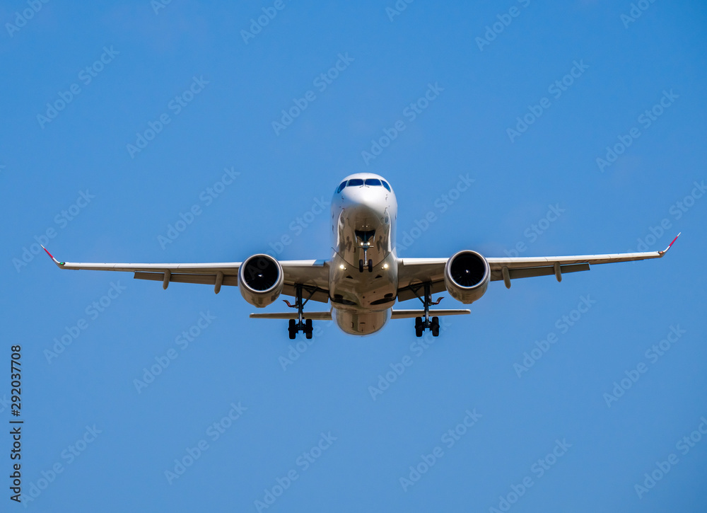 Passenger airplane in the blue sky