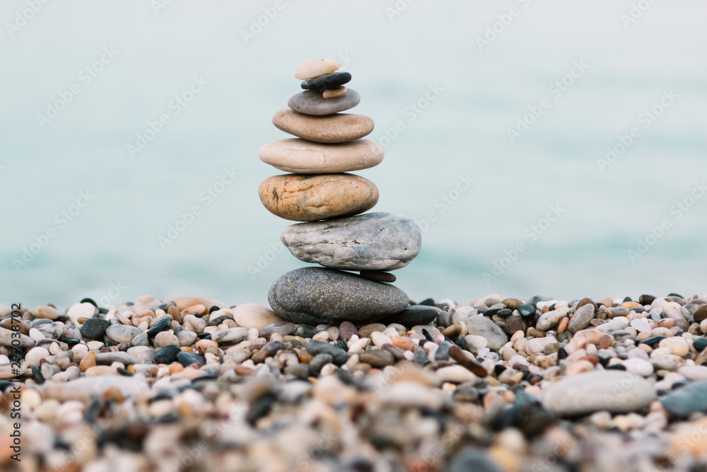 Stack of pebble Stones on ocean background. Peaceful and calm concept