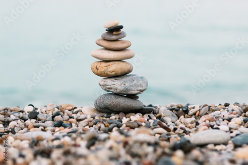Stack of pebble Stones on ocean background. Peaceful and calm concept