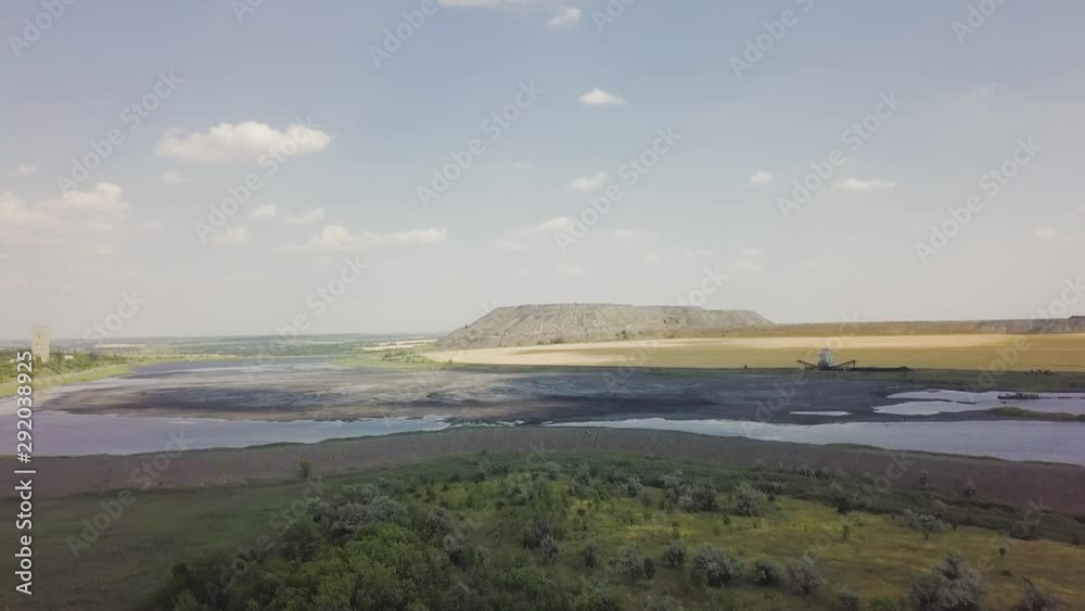 Drone flying over cracked earth and water Drone flying over cracked earth and water