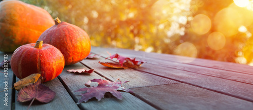 Autumn pumpkin on wooden table; thanksgiving holiday party background, photo
