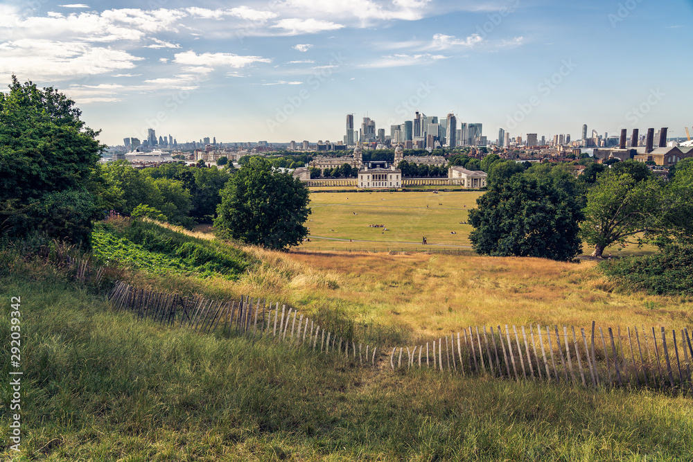 London panorama seen from Greenwich park viewpoint. Symbolic Broken fence in the foreground