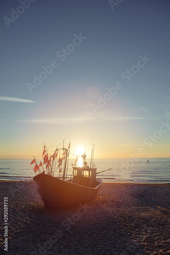 fisherman boats at sunrise time on the beach