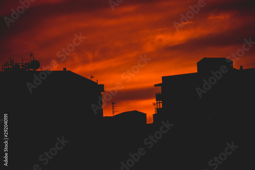 silhouette of city at sunset