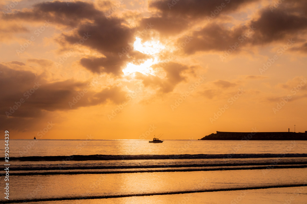 a beautiful sunrise on the beach of La Salve, in Laredo, cantabria