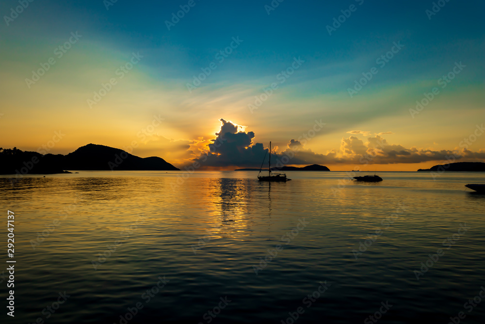 Sunrise Through a Rain Cloud in the Ocean