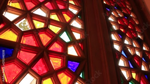 Beautiful stained glass windows with sunlight in the background