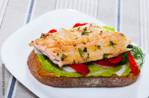 Appetizing sandwich with roasted trout