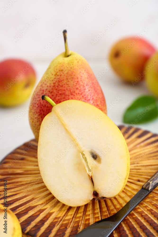 Tasty fresh pears with knife on cutting board, closeup Tasty fresh pears with knife on cutting board, closeup