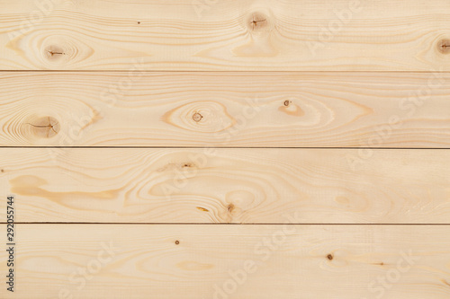 Freshly-planed wood planks closeup photo