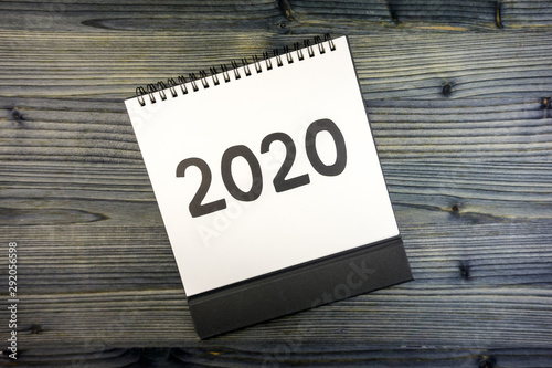 New year 2020 concept: flat lay of desktop calendar