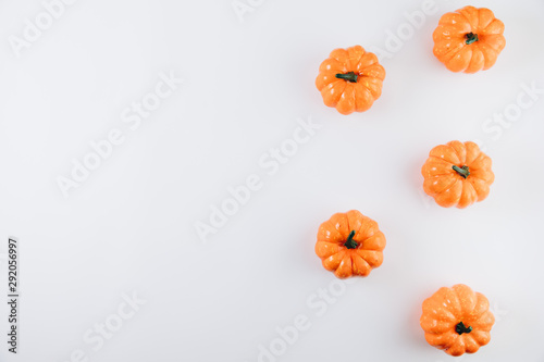 Pumpkins on a white background. Autumn, fall, halloween concept. Flat lay, top view, copy space