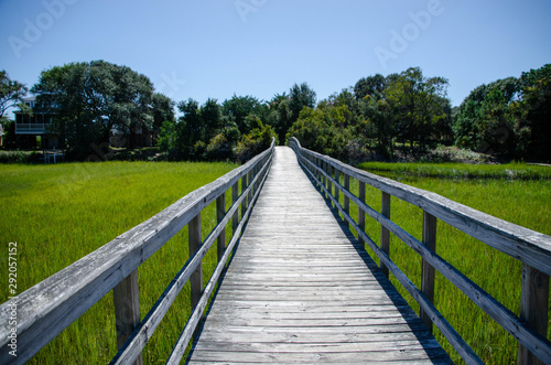 Wooden walkway over the marsh at Oak Island North Carolina © Rick