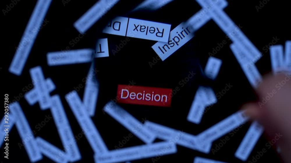 Hand with magnifier focuses on phrase Decision. Finding solutions. Tag cloud on dark wooden table. Hand with magnifier focuses on phrase Decision. Finding solutions. Tag cloud on dark wooden table.