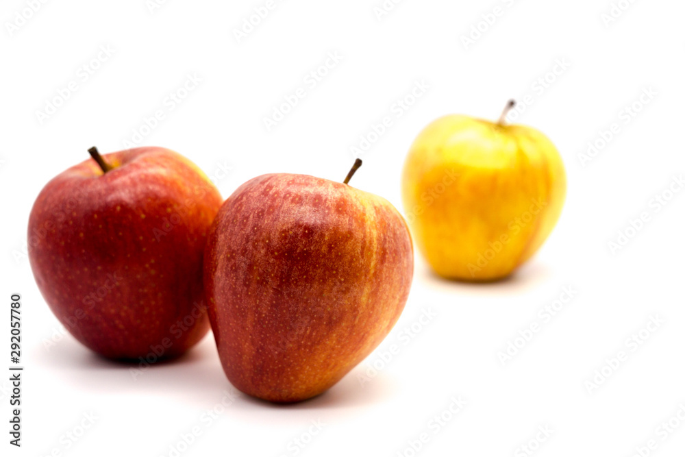 red apples together with the yellow apple seperated red apples together with the yellow apple seperated