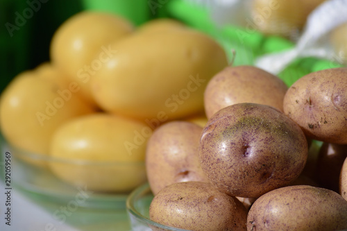Potato tubers close-up on a glass plate