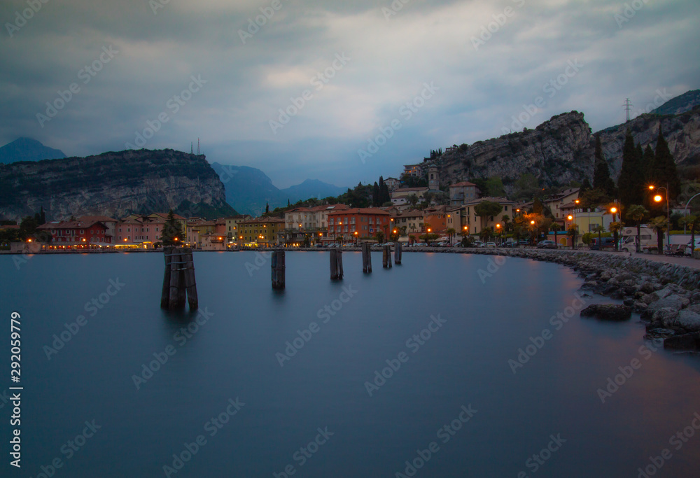 evening at torbole - a colorful village infront of monte brione at lake garda situated in trentino northern italy