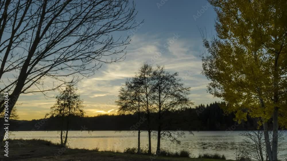Timelapse 4K with sunset sky, lake and autumn colors. Timelapse 4K with sunset sky, lake and autumn colors.