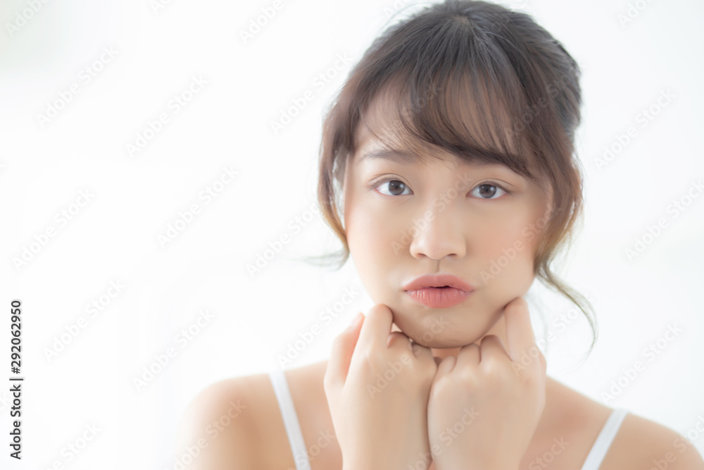 Portrait of beautiful young asian woman smile while wake up healthy and wellness with sunrise at morning in the bedroom, asia girl skin care with happy with fresh, lifestyle and relax concept. Portrait of beautiful young asian woman smile while wake up healthy and wellness with sunrise at morning in the bedroom, asia girl skin care with happy with fresh, lifestyle and relax concept.