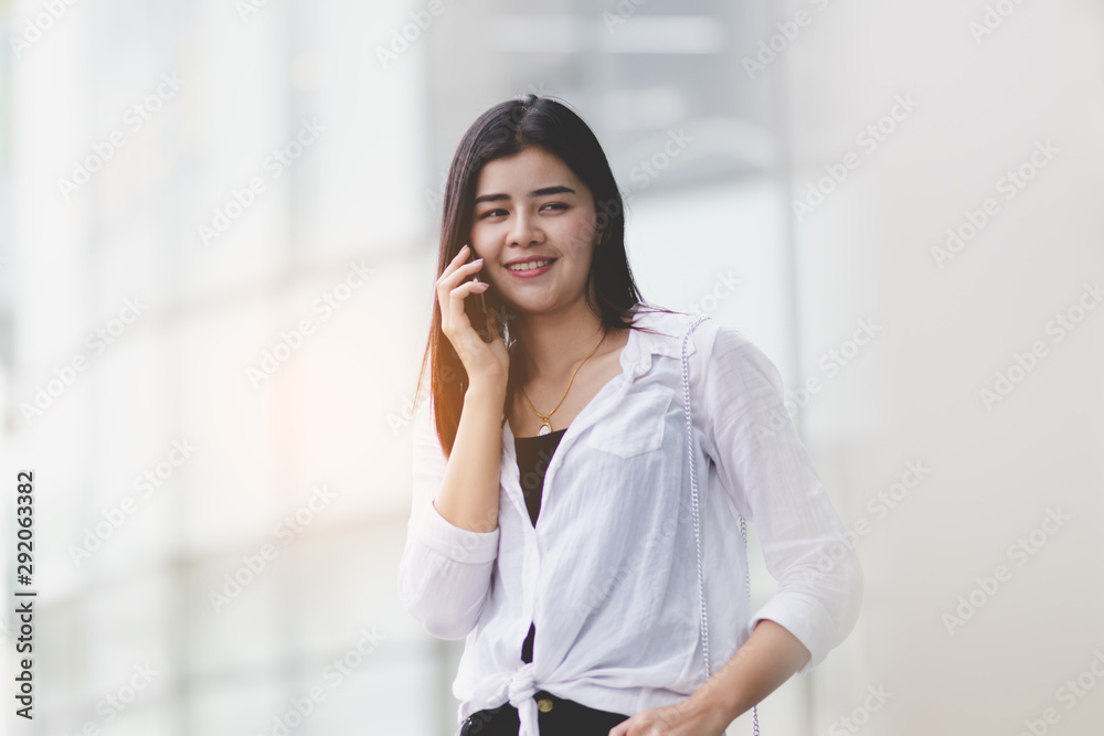 Asia woman using smartphone working,playing with happy. Asia woman using smartphone working,playing with happy.