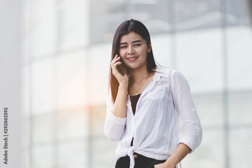 Fototapeta premium Asia woman using smartphone working,playing with happy.